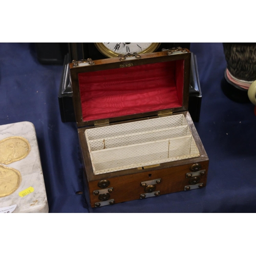 158 - Walnut and dome top hinged casket decorated with mother-of-pearl and metal studs, 19cm wide.