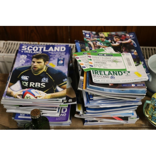 162 - Rugby programmes and a suit carrier.