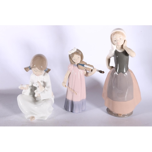 24 - Four Nao figurines to include a girl with violin, and three other girls.  (4)