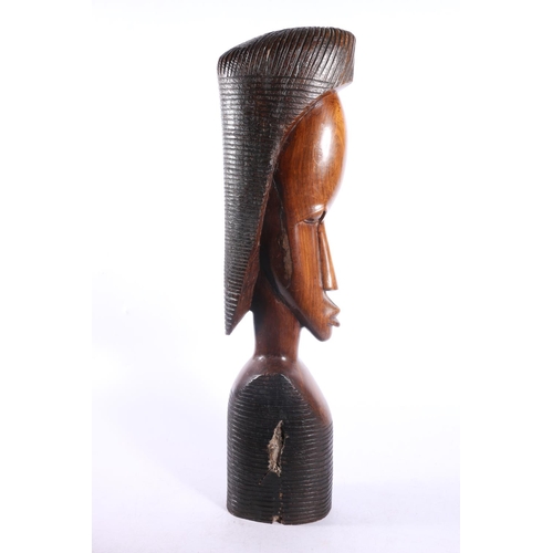 38 - Three carved treen African figures, tallest measures, 58cm.