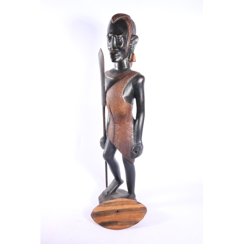 38 - Three carved treen African figures, tallest measures, 58cm.