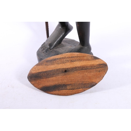 38 - Three carved treen African figures, tallest measures, 58cm.