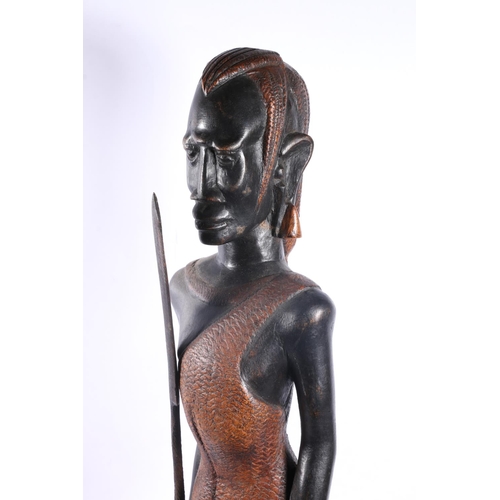 38 - Three carved treen African figures, tallest measures, 58cm.