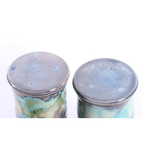 39 - Two similar Studio Pottery lustre vases with blue drip glaze decoration, marked 'FID 06' to base, 17... 