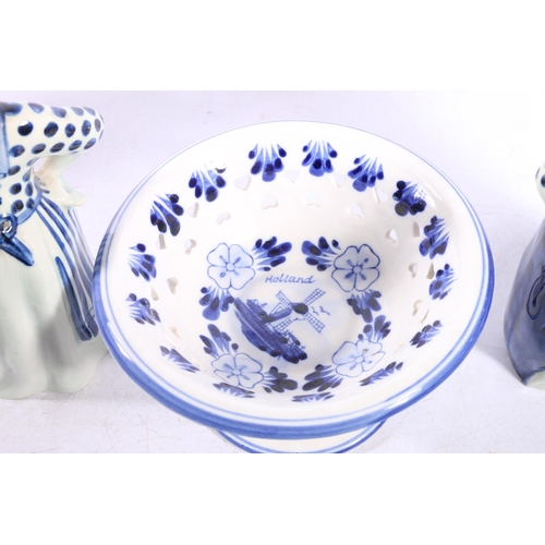 40 - Dutch style pottery to include a Delft figure, a character jug, a ginger jar, etc.  (5)