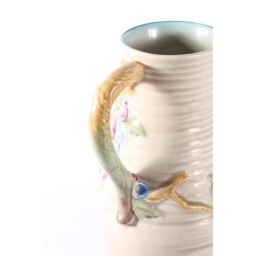 47 - Clarice Cliff floral decorated vase, 21cm.