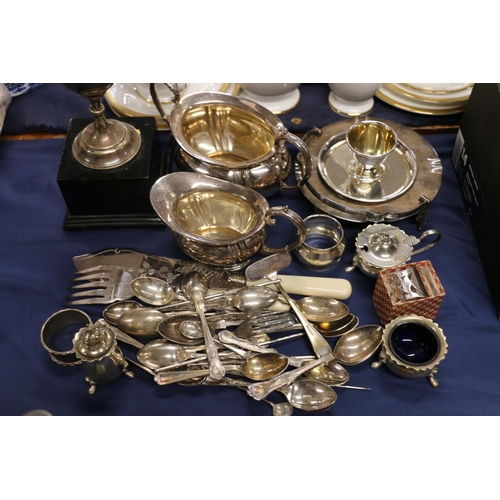 70 - EPNS trophy cup on stand, a part tea service, and EPNS flatware.