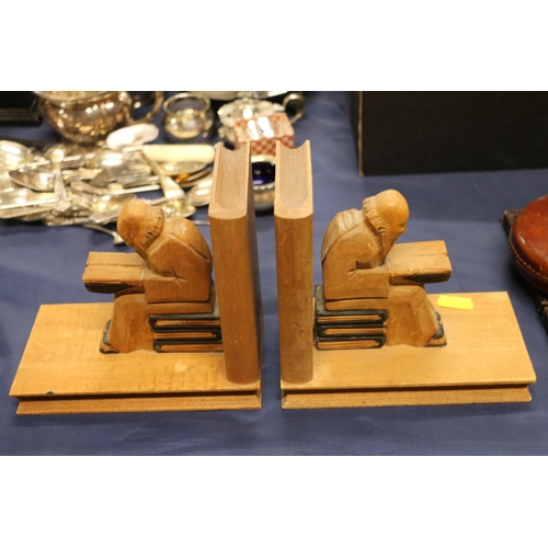 71 - Pair of carved treen bookends formed as seated figures.