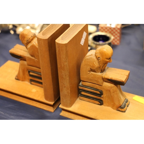 71 - Pair of carved treen bookends formed as seated figures.