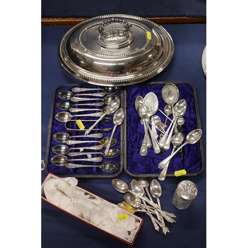 74 - Silver-plated ware to include an entrée dish, flatware, etc., and a silver topped toilet jar decorat... 