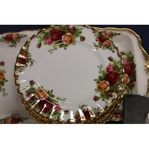 81 - Royal Albert Old Country Roses to include a sandwich plate, side plates, a cheese knife, a miniature... 