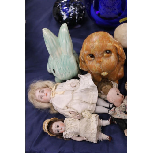 94 - Two bisque porcelain piano dolls, and six small bisque headed dolls.