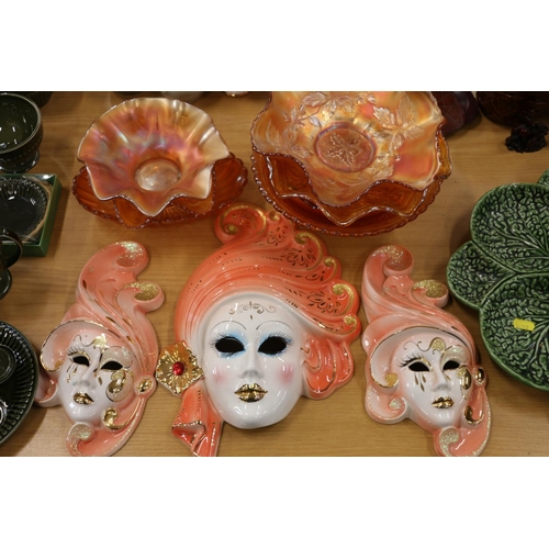 98A - Eight pieces of carnival glass, and a set of three graduated ceramic wall masks.