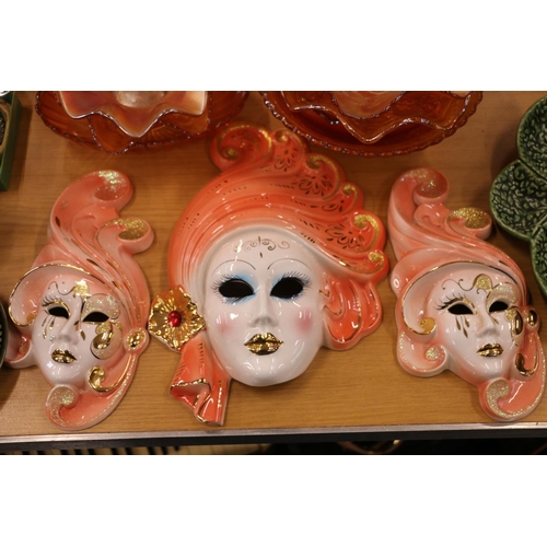 98A - Eight pieces of carnival glass, and a set of three graduated ceramic wall masks.