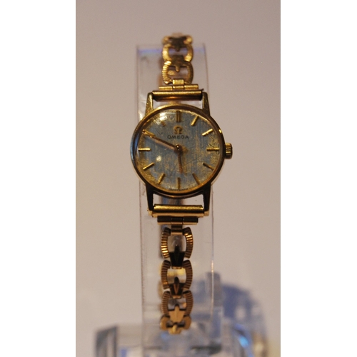 104 - Omega lady's wristwatch with silvered dial, gold baton indices, on pierced rolled gold strap, case d... 