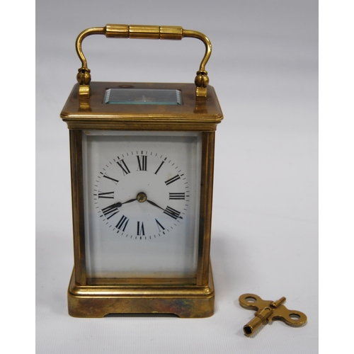 172 - Brass four glass carriage clock with viewing window to the top displaying the movement, the white en... 