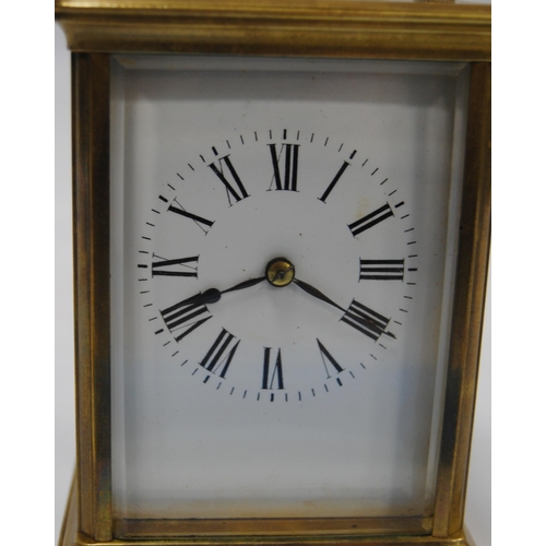 172 - Brass four glass carriage clock with viewing window to the top displaying the movement, the white en... 