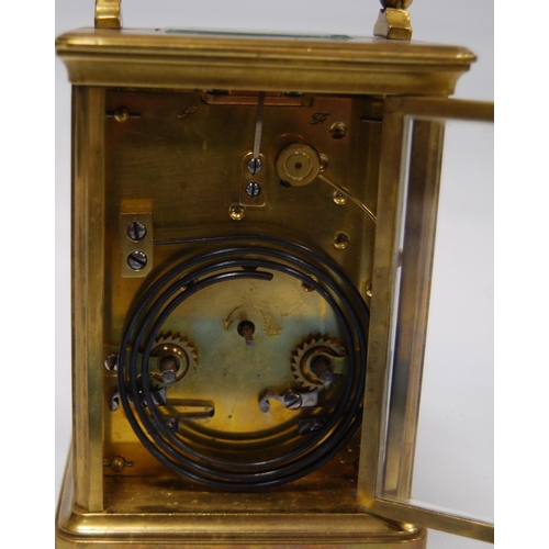 172 - Brass four glass carriage clock with viewing window to the top displaying the movement, the white en... 