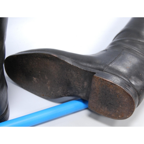 176 - Pair of black leather riding boots with wooden trees, brass ring handles to the trees, sole length a... 