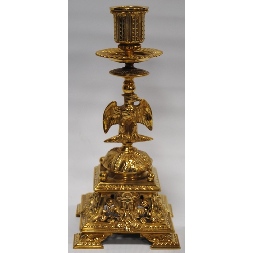 184 - Pair of Neo-Classical influence brass candlesticks, each with a shaped sconce above an eagle knopped... 