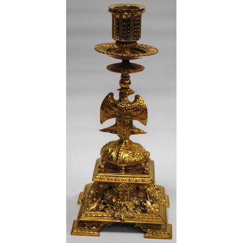 184 - Pair of Neo-Classical influence brass candlesticks, each with a shaped sconce above an eagle knopped... 