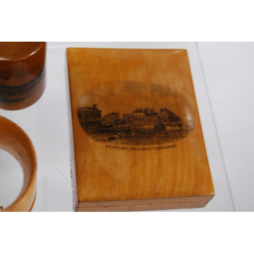 316 - Group of Mauchline ware to include a string box, glass holders, pill box, ring box, cylindrical boxe... 