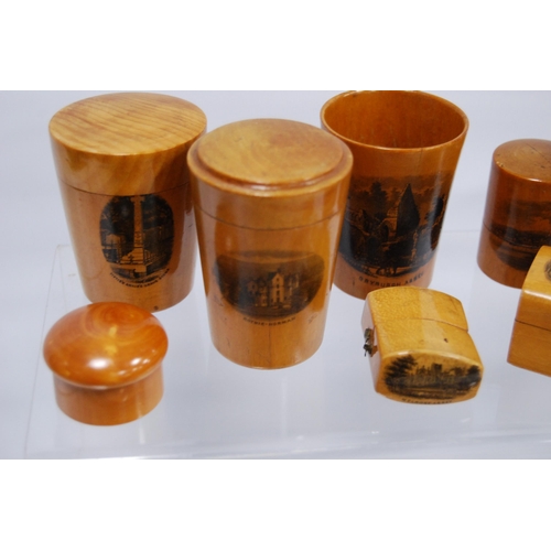 316 - Group of Mauchline ware to include a string box, glass holders, pill box, ring box, cylindrical boxe... 