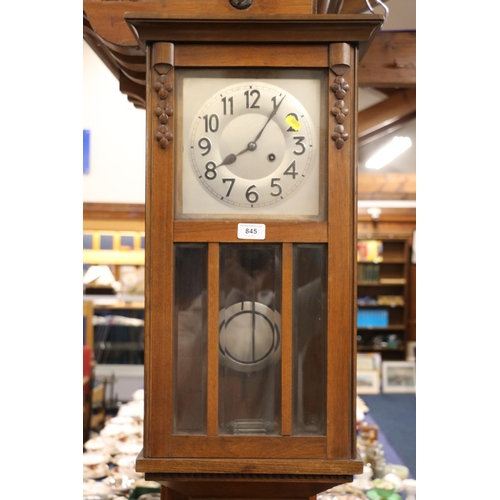 845 - Mahogany cased wall clock. 