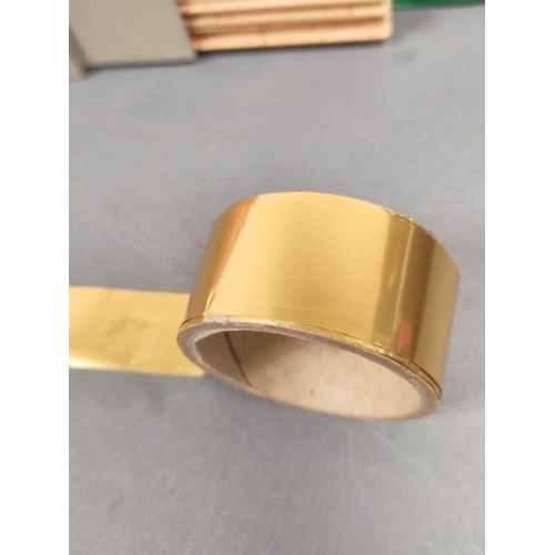 14 - Bookbinding material to include five rolls of gold foil, a box of twine, an electric stylus, and oth... 