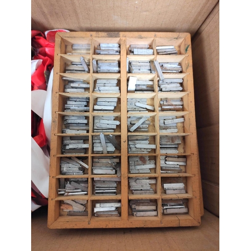 21 - Two boxes containing an assortment of printers type.