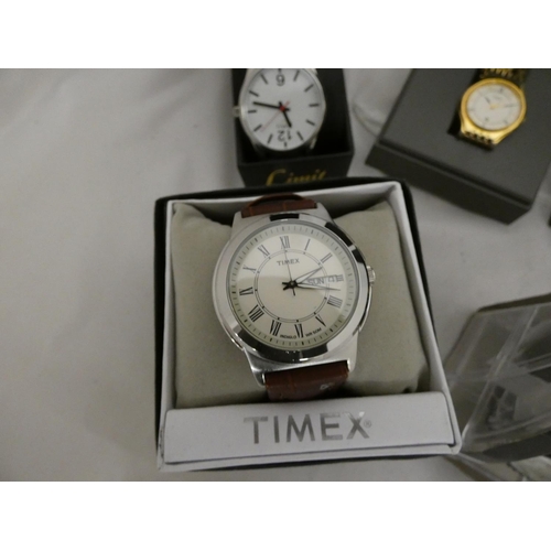 136 - Seven boxed modern men's watches including Limit, Timex, Sekonda, QQ, Slazenger.