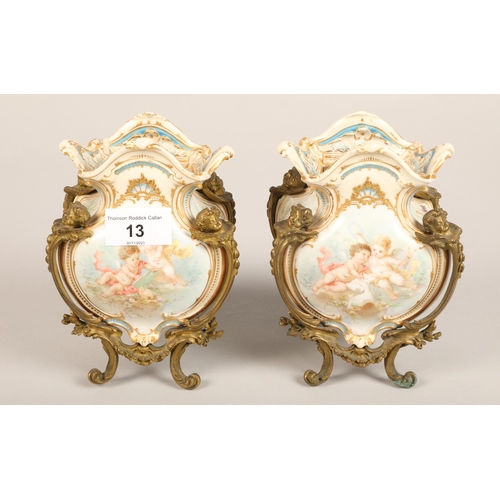 13 - Pair of gilt mounted garniture vases, with putti, 16 cm high (2)