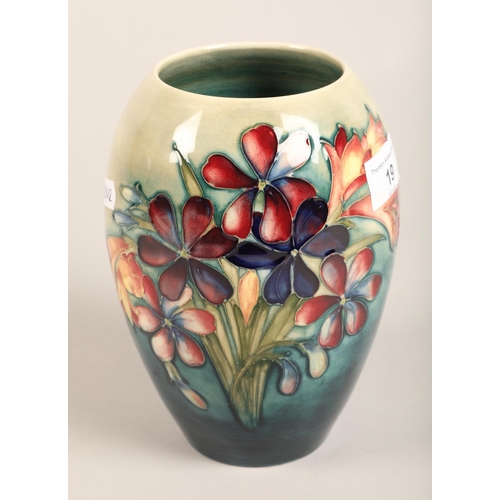 19 - Moorcroft 'Spring Flowers' vase, impressed marks and signed to the base 18 cm high