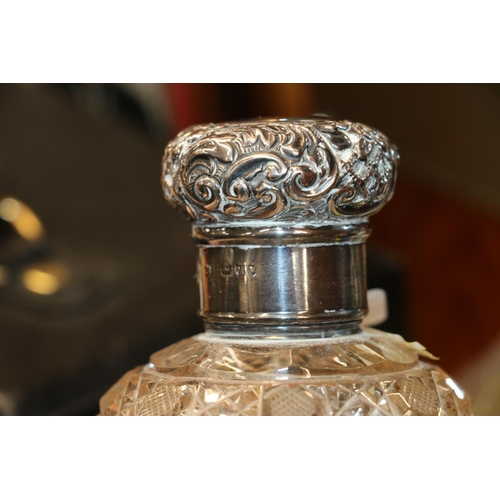 686 - Two silver mounted cut glass globular scent bottles, 13cm and 12cm high.