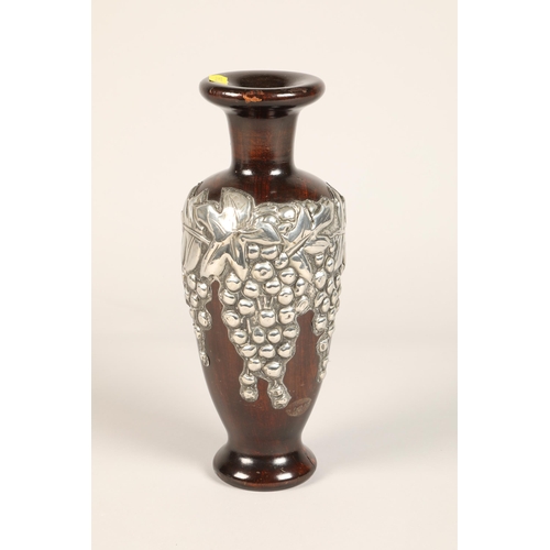 164 - White metal and wood vase with grape design, 28 cm high