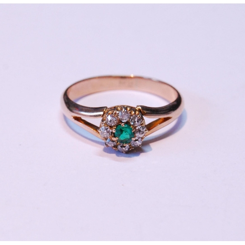 86 - Diamond and emerald cluster ring on bifurcated gold band, size M.