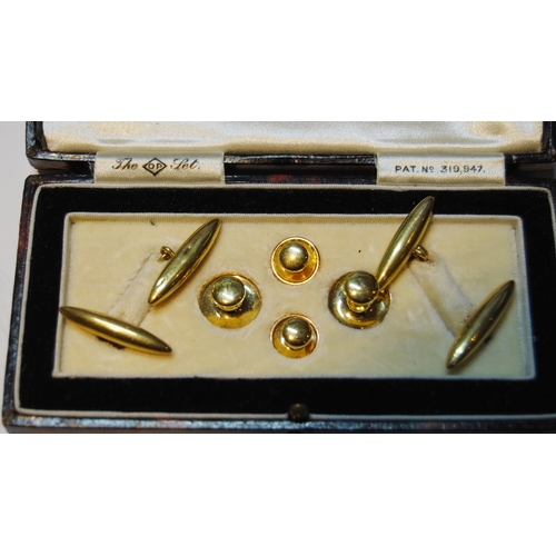 50 - Pair of 18ct gold torpedo cufflinks, two studs, '18ct' (7.7g) and two others, '9ct' (1.5g).