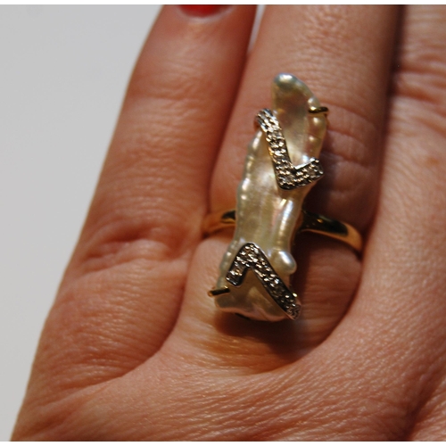 53 - 18ct gold ring with baroque pearl overlaid with two bands of tiny diamonds, size N, 5.4g gross.