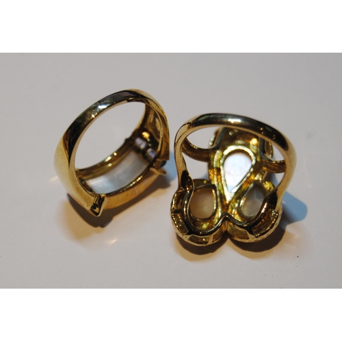 54 - Two 9ct gold rings set with mother of pearl, size N, 11g gross.