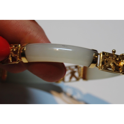 60 - Chinese pale grey jade bangle, in gold, '14k'.