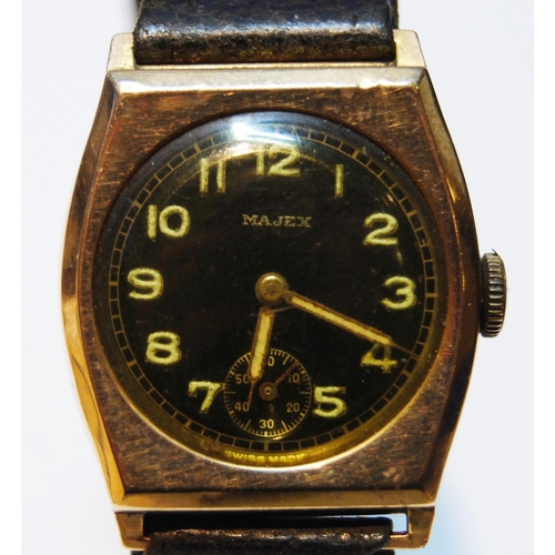 129 - Majex gent's 9ct gold watch of tonneau shape, 1945, on strap.