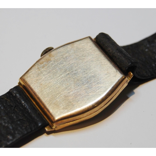 129 - Majex gent's 9ct gold watch of tonneau shape, 1945, on strap.