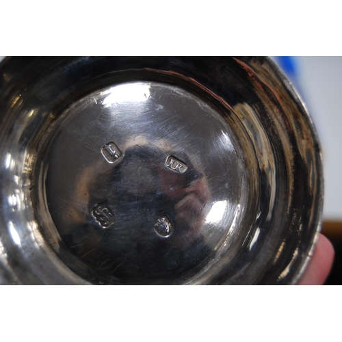 9 - Silver pint mug of baluster shape with scroll handle, by John Kidder, 1784, 26cm, 314g.