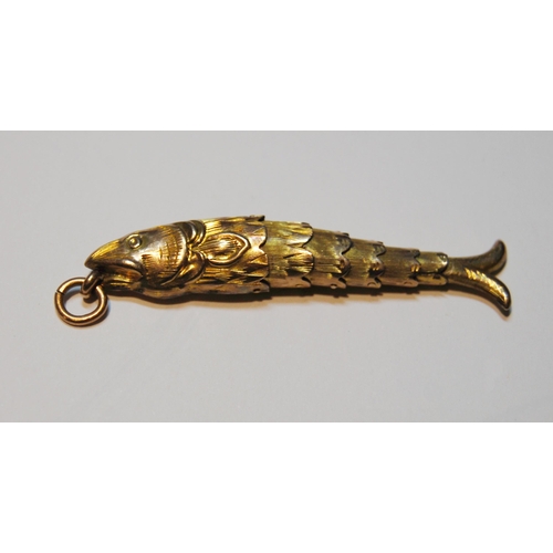 66 - Victorian gold flexible fish pendant, probably 9ct, and a mourning brooch, probably 15ct.