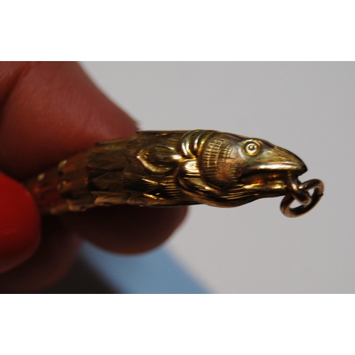 66 - Victorian gold flexible fish pendant, probably 9ct, and a mourning brooch, probably 15ct.