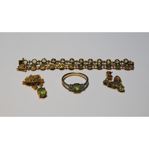 68 - Peridot suite comprising a collet-set bracelet, a ring, a pendant and necklet, and a pair of earring... 