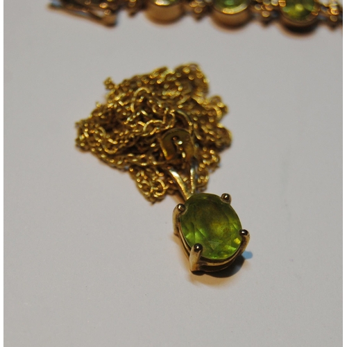 68 - Peridot suite comprising a collet-set bracelet, a ring, a pendant and necklet, and a pair of earring... 