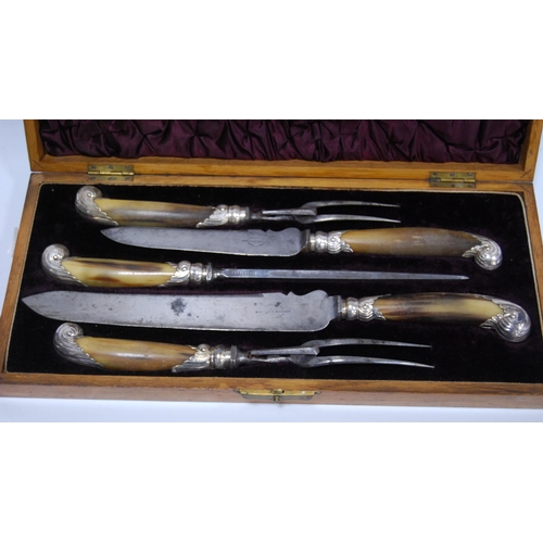 28 - Four-piece carving set with horn handles, with steel, in oak inlaid case.