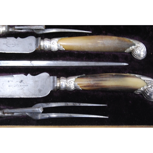 28 - Four-piece carving set with horn handles, with steel, in oak inlaid case.