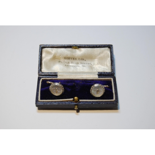 69 - Pair of gold dress cufflinks, with pearl and collet-set diamonds, '14'.